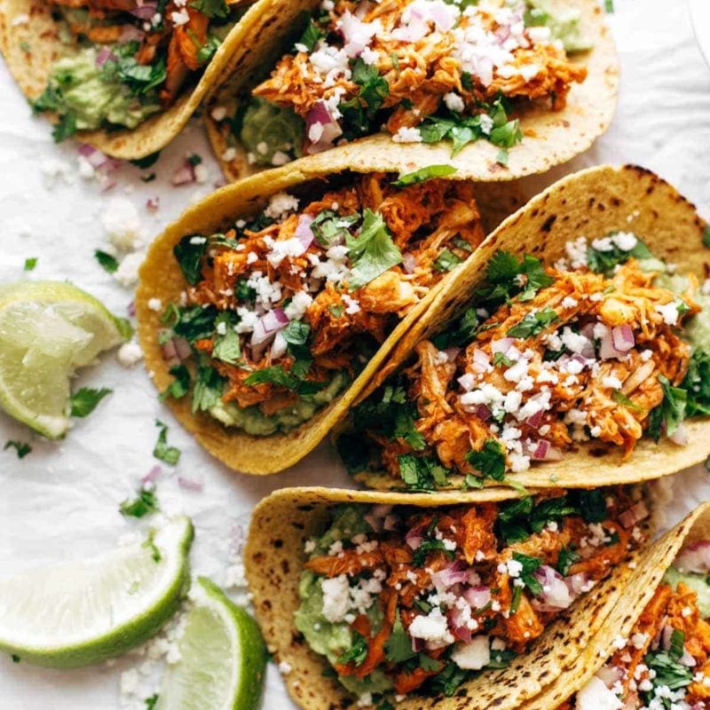 Chicken Tinga Tacos in a row.