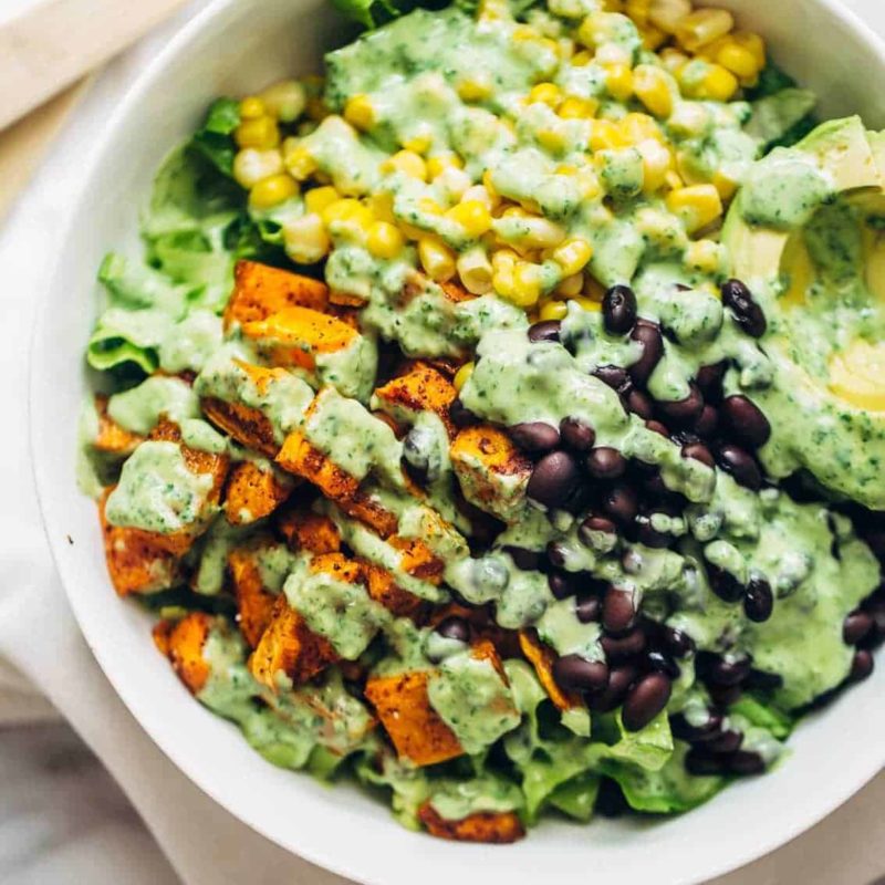 Spicy Southwestern Salad in a serving bowl with avocado dressing.