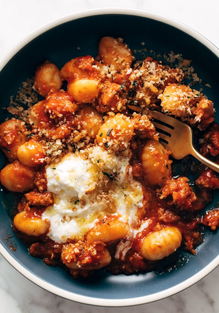 Gnocchi with red sauce and ricotta in a bowl.