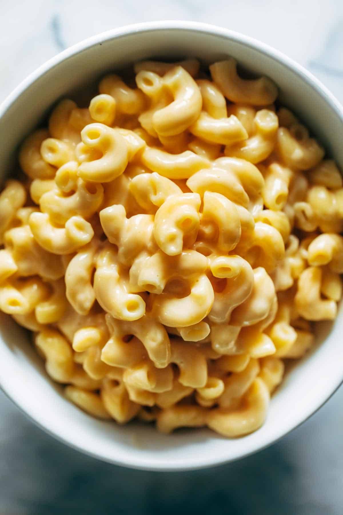 Mac and cheese piled high in a bowl. 