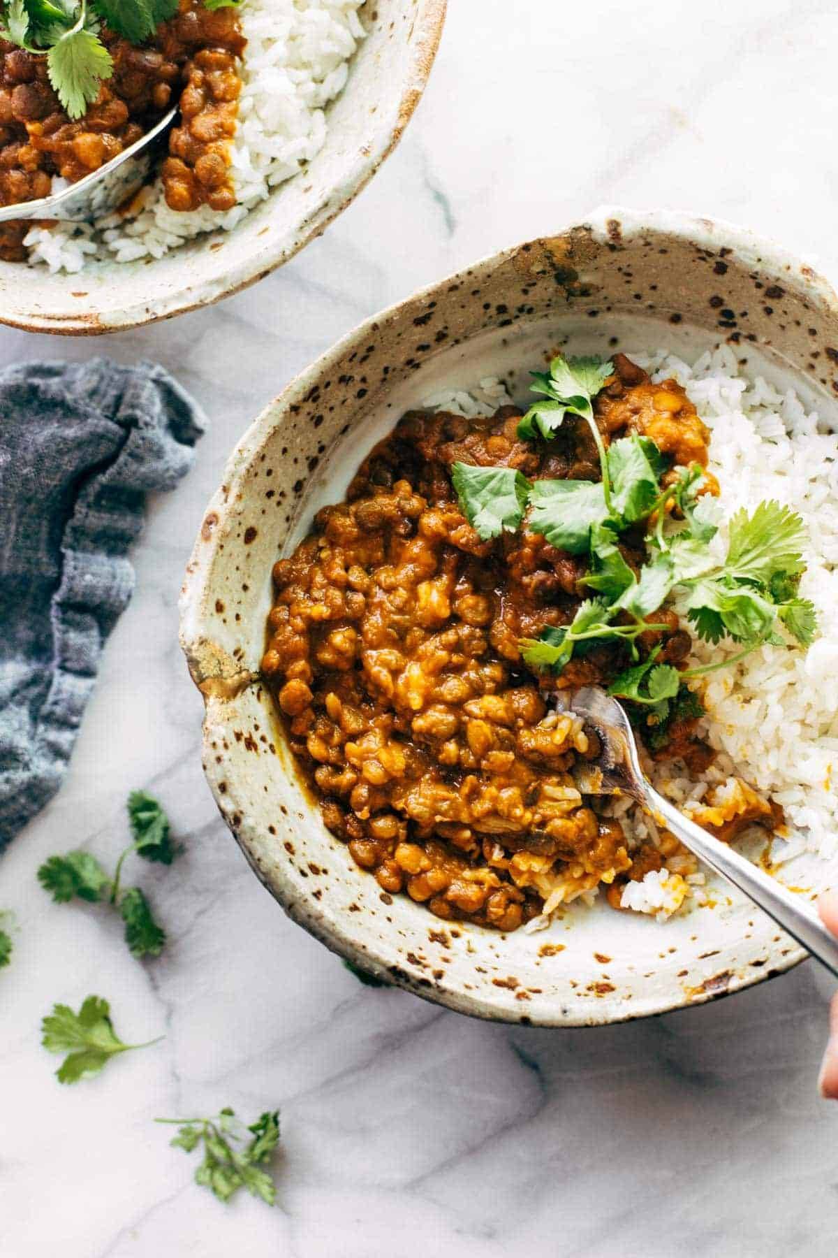 Red curry lentils in a bowl with rice.