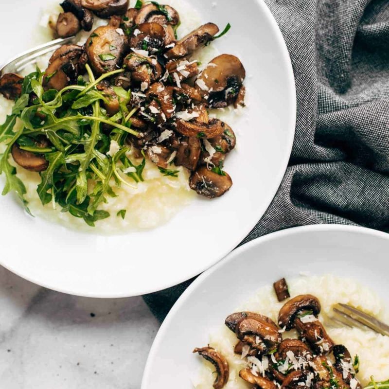 A picture of Oven Risotto with Garlic Roasted Mushrooms and Arugula