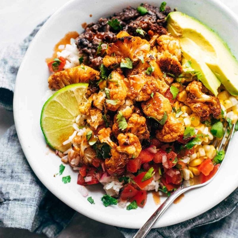 Roasted Cauliflower Burrito Bowl with toppings.
