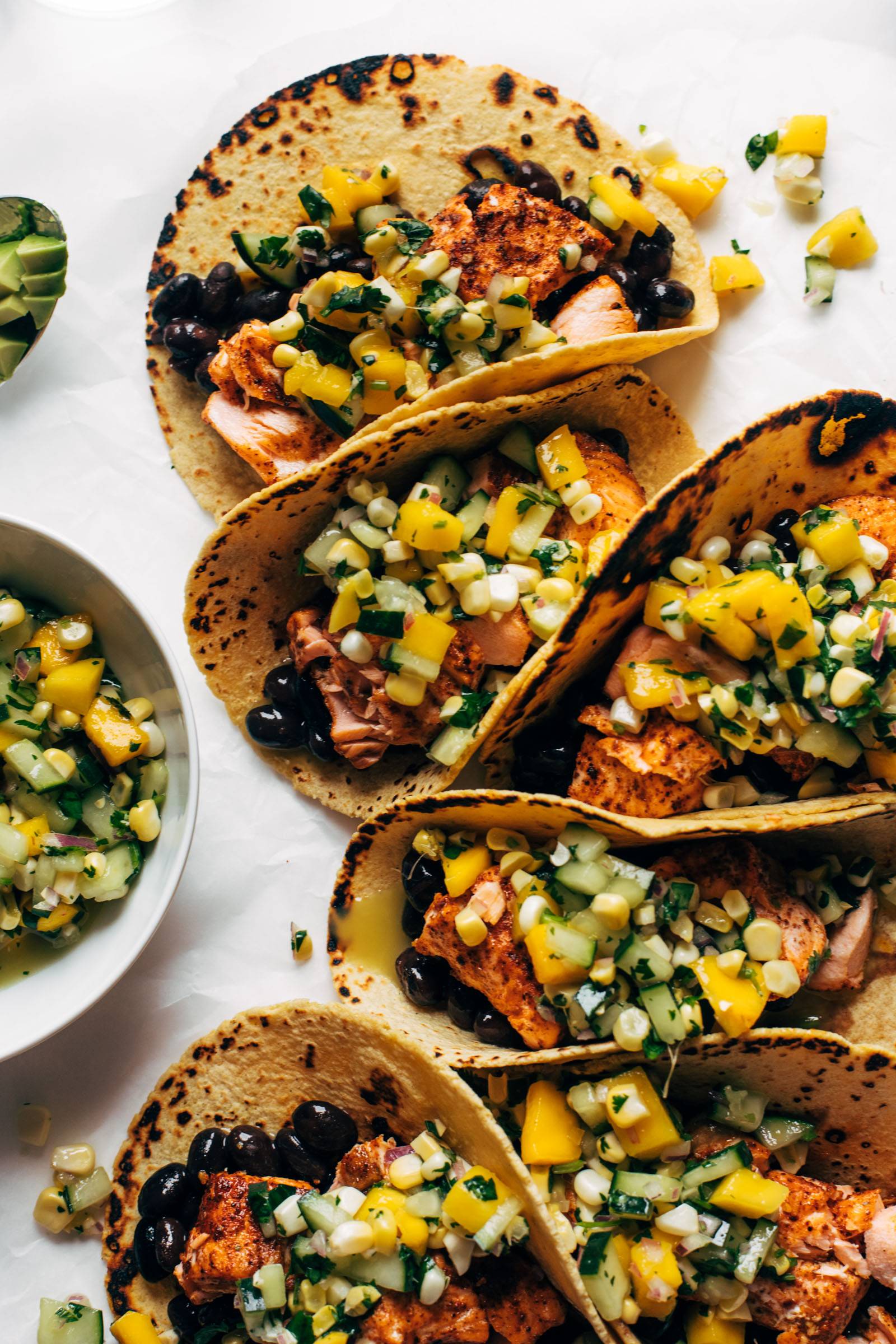 Salmon tacos with cucumber salsa lined up