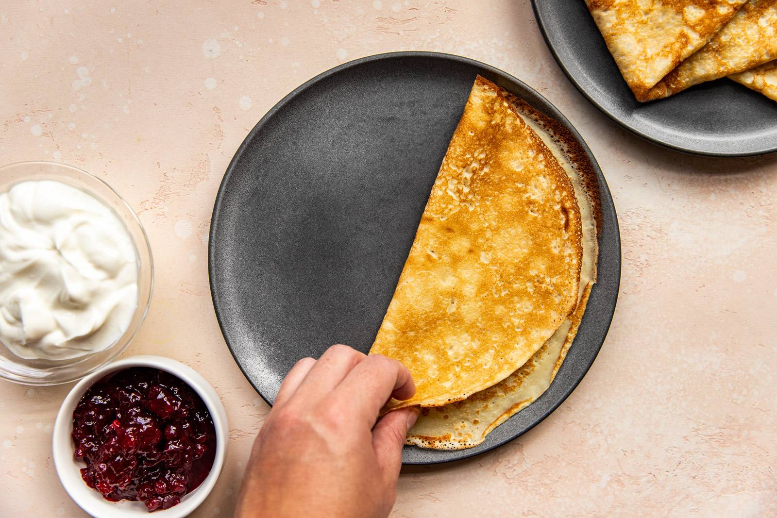 Swedish pancake folded in half on a plate.
