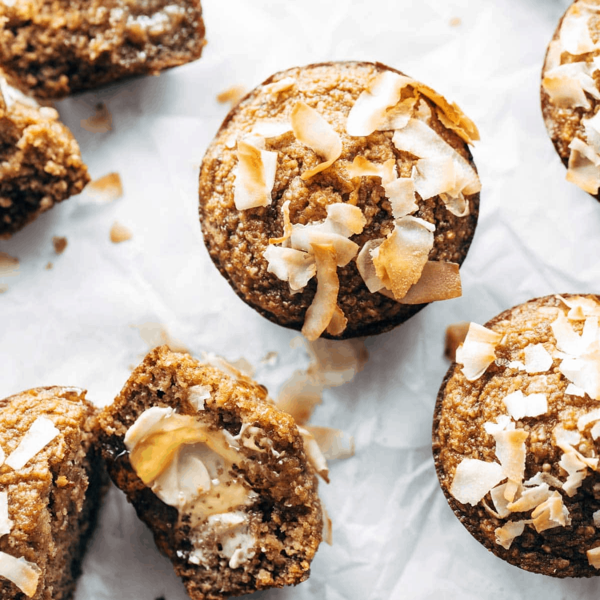 Apple muffins topped with coconut.
